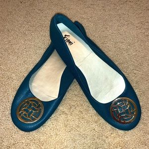 Never worn teal flats with gold buckle